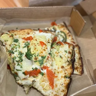 two slices of pizza in a box