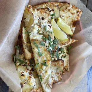 Special Pizza of the Day slices : corn, potato, chives, etc.