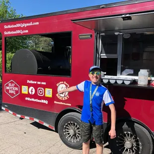 a man standing in front of a food truck