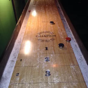 a shuffle table in a basement