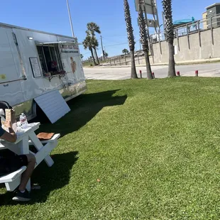 Picinic table and plenty of free parking. Open field on green grass. Bring a planner and have a picnic in a sunny day.