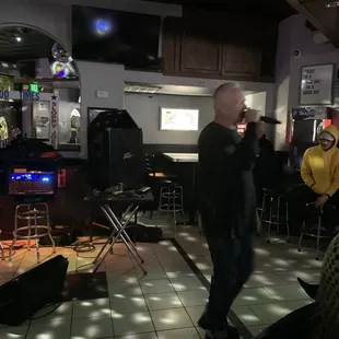 a man singing into a microphone