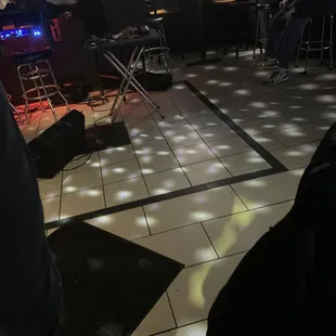 people playing music in a dimly lit room