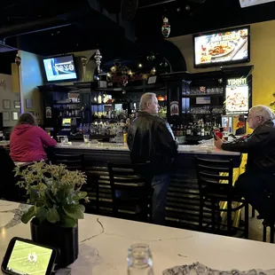people sitting at the bar