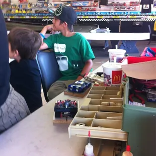 Boys waiting to get their slot car on the track