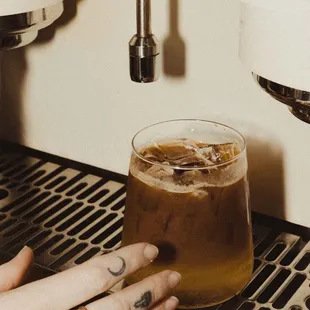 Espresso tonic made with tonic syrup made in house, bubble water topped with a shot of espresso