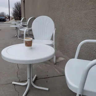 two chairs and a table outside