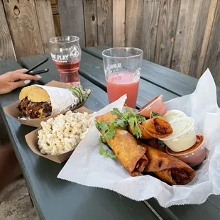 a picnic table with food and drinks