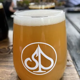 a glass of beer on a table