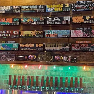 a wall of beer taps