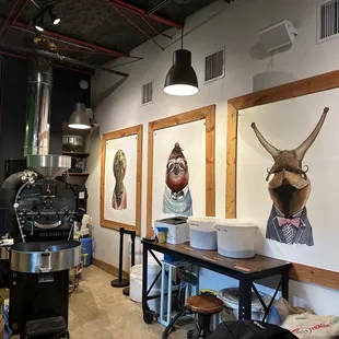 a coffee shop with art on the walls