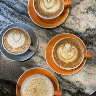 Clockwise from the top: Regular Latte, Vanilla Latte, Caramel Macchiato, Coconut Milk Flat White