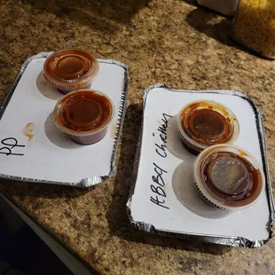 three trays of food on a counter