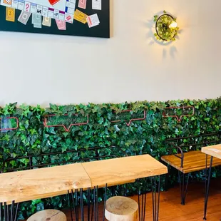 a row of tables and stools