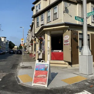 a street corner with a sidewalk sign