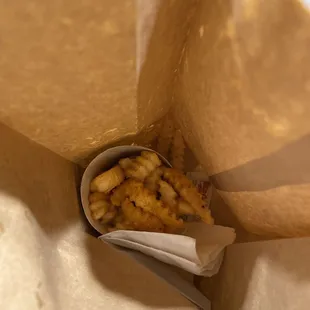 a piece of food in a paper bag