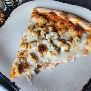 Thin crust sausage pizza at Slyce.
