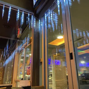 The front entrance viewed from the inside with the seasonal icicle lights