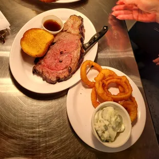 a plate of meat and onion rings