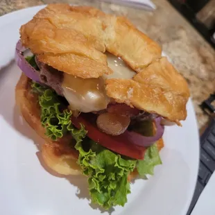 a croissant sandwich on a plate
