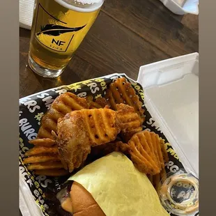 a plate of fries and a beer