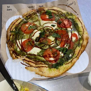 Margarita pizza with pesto instead of red sauce