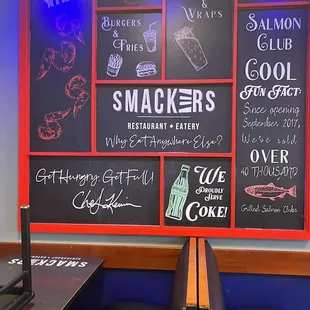 a restaurant with a chalkboard wall