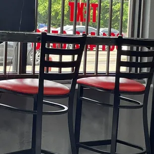 Inside the restaurant with seating faced towards the front window ...