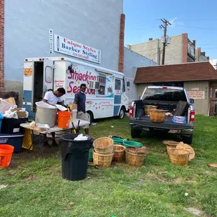  group of people standing in front of a food truck