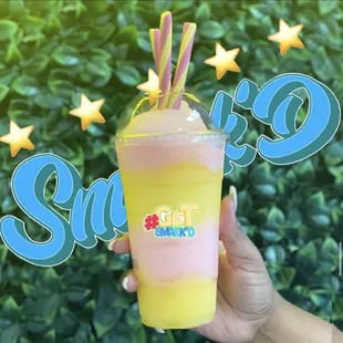 a hand holding a cup of tea