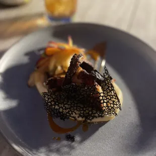 Old fashioned drink, and appetizer Seared Octopus - Heirloom carrot salad, cashews, spicy passion fruit dressing, squid ink crisp