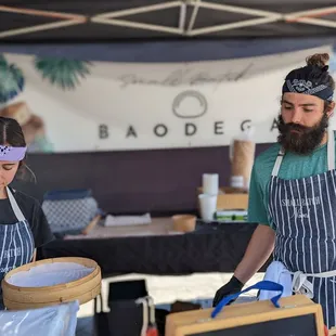 a man and a woman preparing food