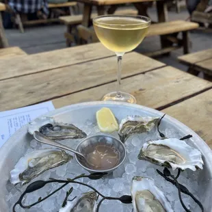 Happy hour - $2 oysters and $2 off house sparkling wine.