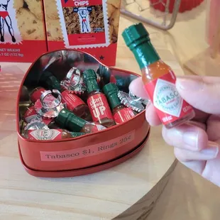 Mini Tobasco sauce bottles ($1/each) and plastic rings  (25 cents/each)