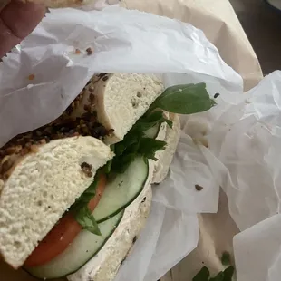 Onion bagel with veggies and salmon spread