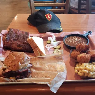 Sliced brisket sandwich, 1/3 rack ribs, beans, mac and cheese, &amp; hushpuppies.