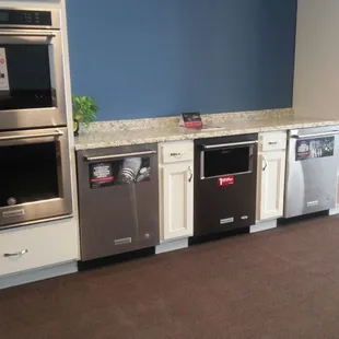 Double wall ovens, gas and electric cook tops on display