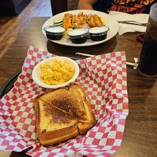 a grilled cheese sandwich and macaroni and cheese