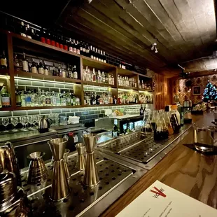 a bar with many bottles of alcohol