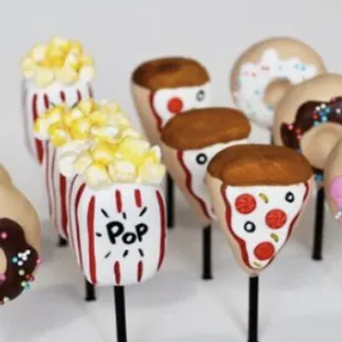 a variety of donuts on sticks