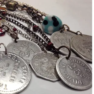 Vintage Kansas trade tokens, turned into keepsake pieces of jewelry.