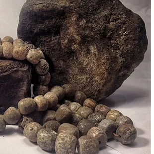 Stegodon bone, fossilized, turned into beads, come from Java, Indonesia.  Approx 1.9 million years old.