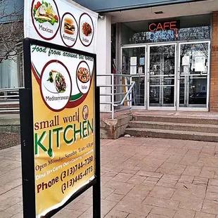 a sign in front of a restaurant