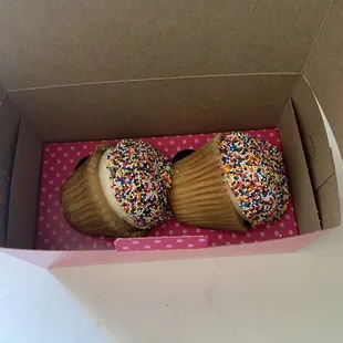 Fallen cupcakes due to improper packaging. The holes for the cupcakes are too large causing a lot of movement during transport.