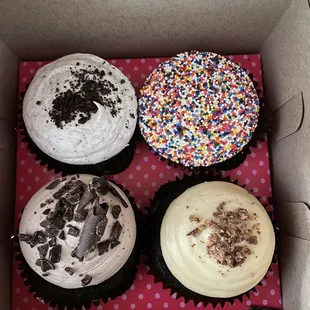 Starting at the top Left: Cookies-n-Cream Cupcake, Birthday Cupcake, Peanut Butter Cupcake, Chocoholic Cupcake at bottom left!