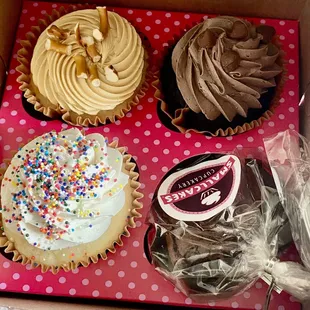 a variety of cupcakes in a box