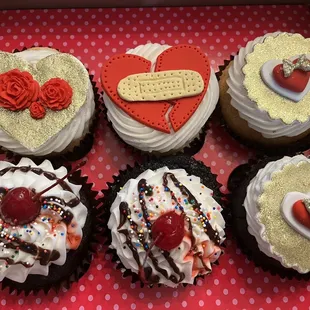 a variety of cupcakes in a box