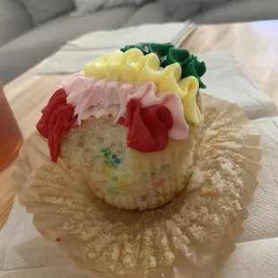 a cupcake with frosting and sprinkles