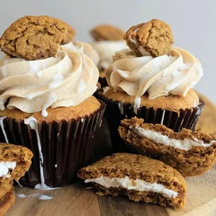 cupcakes with frosting and cookies