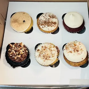 a dozen cupcakes in a box